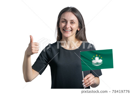 Happy young white woman holding flag of Macau and shows the class by hand isolated on a white background Happy young white woman holding flag of Macau and shows the class by hand isolated on a white background 78419776