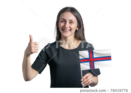 Happy young white woman holding flag of Faroe Islands and shows the class by hand isolated on a white background Happy young white woman holding flag of Faroe Islands and shows the class by hand isolated on a white background 78419778