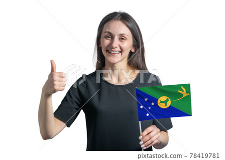 Happy young white woman holding flag of Christmas Island and shows the class by hand isolated on a white background Happy young white woman holding flag of Christmas Island and shows the class by hand isolated on a white background 78419781