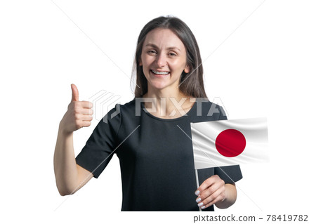 Happy young white woman holding flag of Japan and shows the class by hand isolated on a white background Happy young white woman holding flag of Japan and shows the class by hand isolated on a white background 78419782