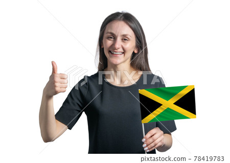 Happy young white woman holding flag of Jamaica and shows the class by hand isolated on a white background Happy young white woman holding flag of Jamaica and shows the class by hand isolated on a white background 78419783