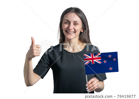 Happy young white woman holding flag of New Zealand and shows the class by hand isolated on a white background 78419877