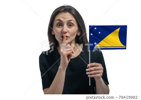 Happy young white woman holding flag of Tokelau and holds a finger to her lips isolated on a white background Happy young white woman holding flag of Tokelau and holds a finger to her lips isolated on a white background 78419982