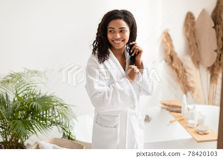 African American Lady Touching Hair After Shower Posing In Bathroom African American Lady Touching Hair After Shower Posing In Bathroom 78420103