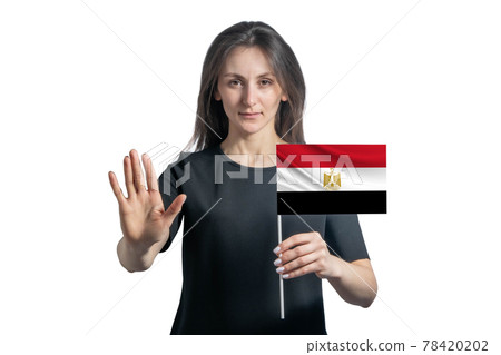 Happy young white woman holding flag of Egypt and with a serious face shows a hand stop sign isolated on a white background 78420202