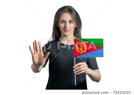 Happy young white woman holding flag of Eritrea and with a serious face shows a hand stop sign isolated on a white background Happy young white woman holding flag of Eritrea and with a serious face shows a hand stop sign isolated on a white background 78420205