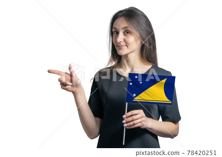 Happy young white woman holding flag Tokelau and points to the left isolated on a white background Happy young white woman holding flag Tokelau and points to the left isolated on a white background 78420251