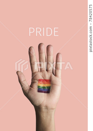 hand with a rainbow pride flag and text pride hand with a rainbow pride flag and text pride 78420575