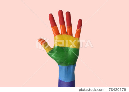 raised hand painted as the rainbow flag 78420576