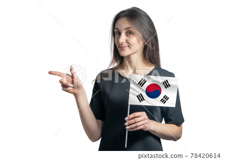 Happy young white woman holding flag South Korea and points to the left isolated on a white background 78420614