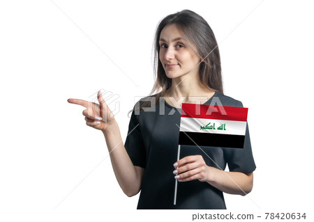 Happy young white woman holding flag Iraq and points to the left isolated on a white background 78420634