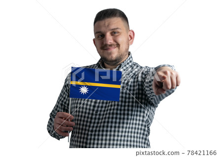 White guy holding a flag of Nauru and points forward in front of him isolated on a white background 78421166