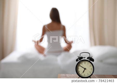 Woman stretching in bed after wake up, back view, entering a day happy and relaxed after good night sleep. Sweet dreams, good morning, new day, weekend, holidays concept Woman stretching in bed after wake up, back view, entering a day happy and relaxed after good night sleep. Sweet dreams, good morning, new day, weekend, holidays concept 78421463