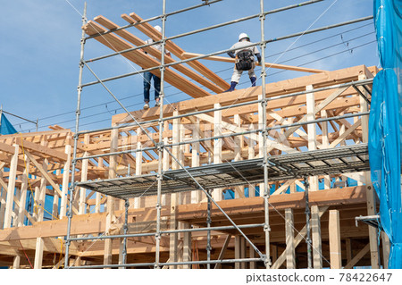 Building up a two-story wooden house 78422647