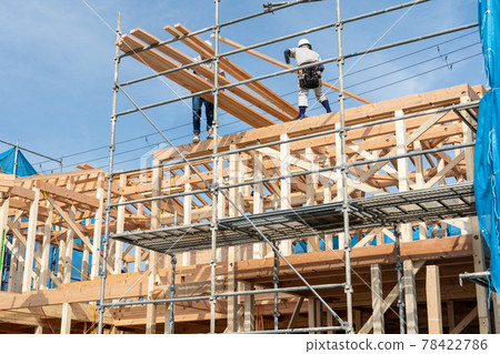 Building up a two-story wooden house 78422786