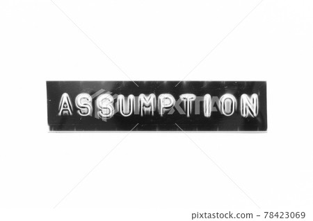Embossed letter with word assumption in black banner on white paper background 78423069