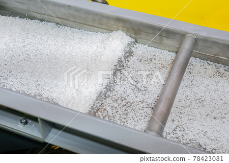 Recycled plastic granules on automatic conveyor belt, shale shaker Recycled plastic granules on automatic conveyor belt, shale shaker 78423081