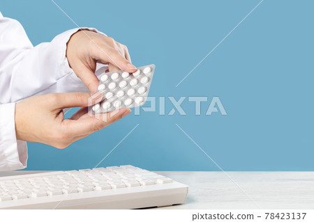 Female doctor pointing at pills. Medicine and pharmacy Female doctor pointing at pills. Medicine and pharmacy 78423137