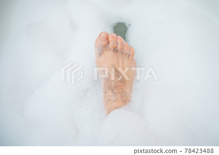 Funny Picture of a Man Taking a Relaxing Bath. Close-up of Male