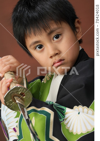 Shichigosan, a child in a kimono with a sword Shichigosan, a child in a kimono with a sword 78424018