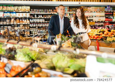 Portrait of a confident young couple in the supermarket 78424577