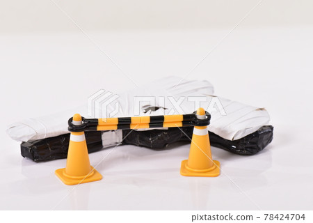 Toy pistol and traffic cones 78424704