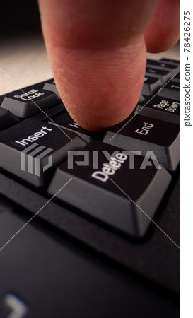 Person finger presses home button with white letters Person finger presses home button with white letters 78426275