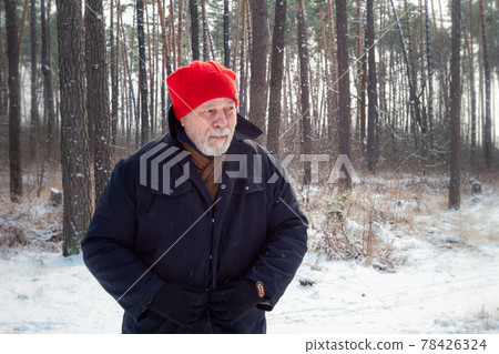 Cheerful aged man with beard admires nature on winter day Cheerful aged man with beard admires nature on winter day 78426324