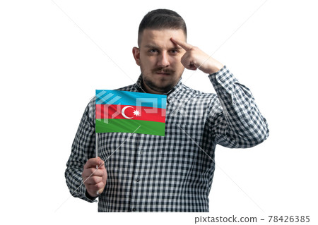 White guy holding a flag of Azerbaijan and a finger touches the temple on the head isolated on a white background 78426385