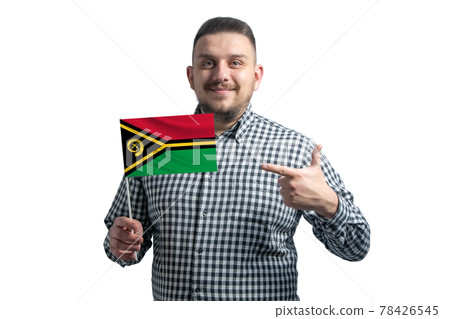 White guy holding a flag of Vanuatu and points the finger of the other hand at the flag isolated on a white background 78426545