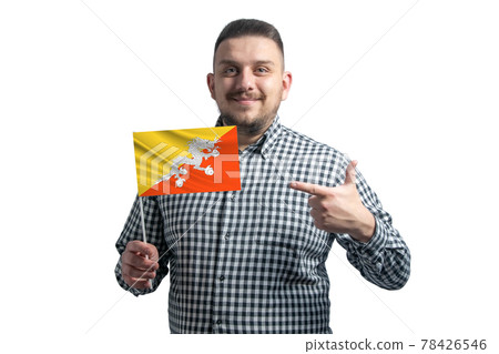 White guy holding a flag of Butane and points the finger of the other hand at the flag isolated on a white background White guy holding a flag of Butane and points the finger of the other hand at the flag isolated on a white background 78426546