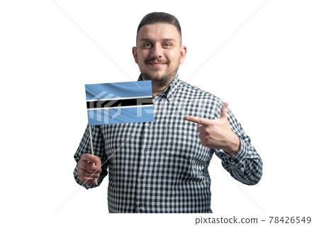 White guy holding a flag of Botswana and points the finger of the other hand at the flag isolated on a white background White guy holding a flag of Botswana and points the finger of the other hand at the flag isolated on a white background 78426549