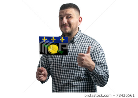 White guy holding a flag of Guadeloupe and shows the class by hand isolated on a white background. Like for Guadeloupe White guy holding a flag of Guadeloupe and shows the class by hand isolated on a white background. Like for Guadeloupe 78426561
