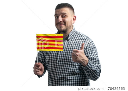 White guy holding a flag of Catalonia and shows the class by hand isolated on a white background. Like for Catalonia White guy holding a flag of Catalonia and shows the class by hand isolated on a white background. Like for Catalonia 78426563