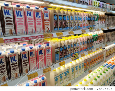 PENANG, MALAYSIA -JULY 9, 2020: Selected focused on milk drinks in boxes that come with various flavors and brands. Displayed on cold shelves. Placed price tag. PENANG, MALAYSIA -JULY 9, 2020: Selected focused on milk drinks in boxes that come with various flavors and brands. Displayed on cold shelves. Placed price tag. 78426597