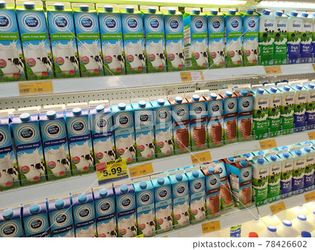 PENANG, MALAYSIA -JULY 9, 2020: Selected focused on milk drinks in boxes that come with various flavors and brands. Displayed on cold shelves. Placed price tag. PENANG, MALAYSIA -JULY 9, 2020: Selected focused on milk drinks in boxes that come with various flavors and brands. Displayed on cold shelves. Placed price tag. 78426602
