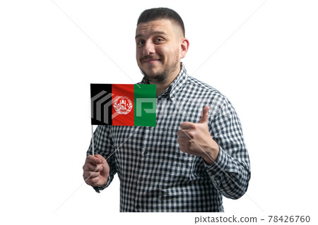 White guy holding a flag of Afghanistan and shows the class by hand isolated on a white background. Like for Afghanistan White guy holding a flag of Afghanistan and shows the class by hand isolated on a white background. Like for Afghanistan 78426760