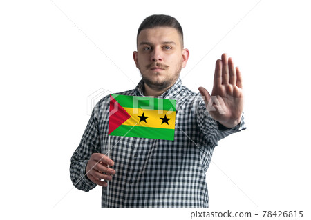White guy holding a flag of Sao Tome and Principe and with a serious face shows a hand stop sign isolated on a white background White guy holding a flag of Sao Tome and Principe and with a serious face shows a hand stop sign isolated on a white background 78426815
