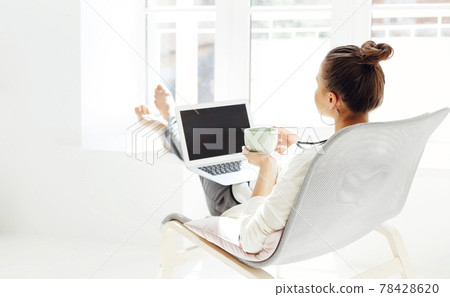 Young woman resting with laptop Young woman resting with laptop 78428620