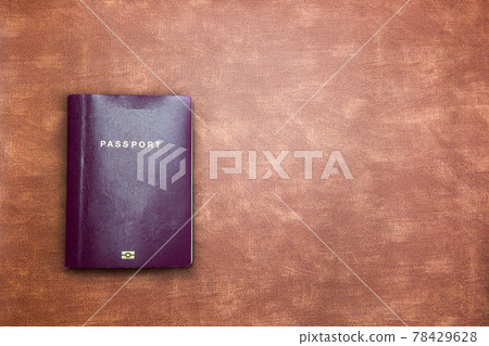 top view image of blank Passport on brown leather background texture with copy space, travel,tourist,document,indentification concept modern design 78429628