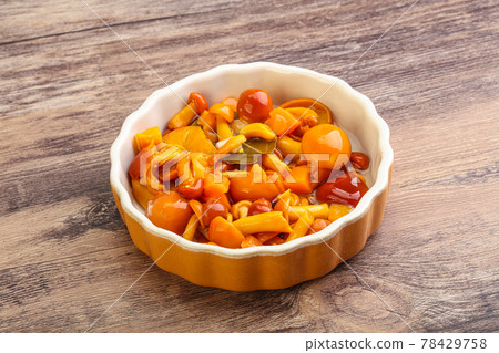 Marinated pickled honey mushrooms in the bowl 78429758