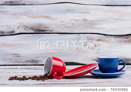 Coffee cups with coffee beans. 78430966