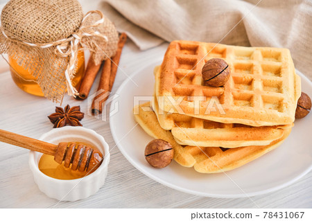 Stack of Belgian waffles on a white plate. Stack of Belgian waffles on a white plate. 78431067