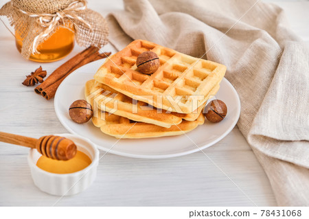 Stack of Belgian waffles on a white plate. Stack of Belgian waffles on a white plate. 78431068