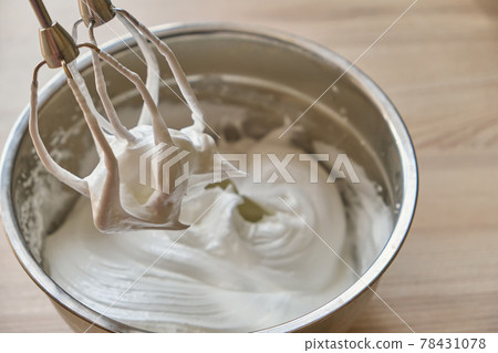 Whipped egg whites and other ingredients for cream on wooden table, closeup Whipped egg whites and other ingredients for cream on wooden table, closeup 78431078
