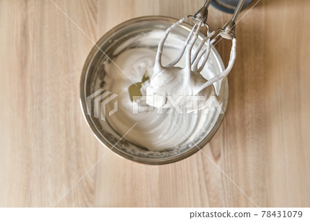 Whipped egg whites and other ingredients for cream on wooden table, closeup Whipped egg whites and other ingredients for cream on wooden table, closeup 78431079