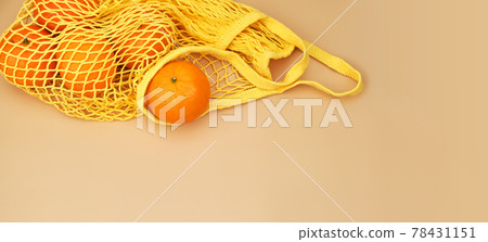 oranges and lemons with mint branches in a string bag oranges and lemons with mint branches in a string bag 78431151