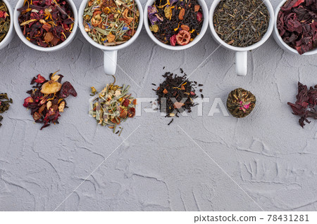Variety of dried tea in white cups. 78431281