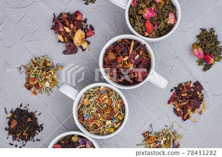 Background of dried healthy tea in white cups. 78431282