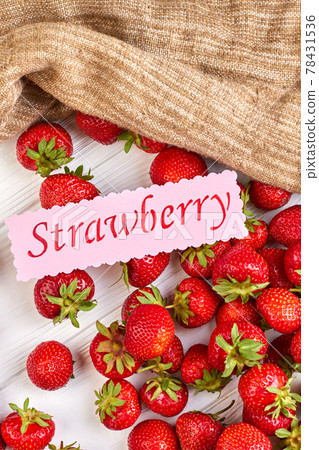 Group of fresh strawberries and sackcloth. Group of fresh strawberries and sackcloth. 78431536